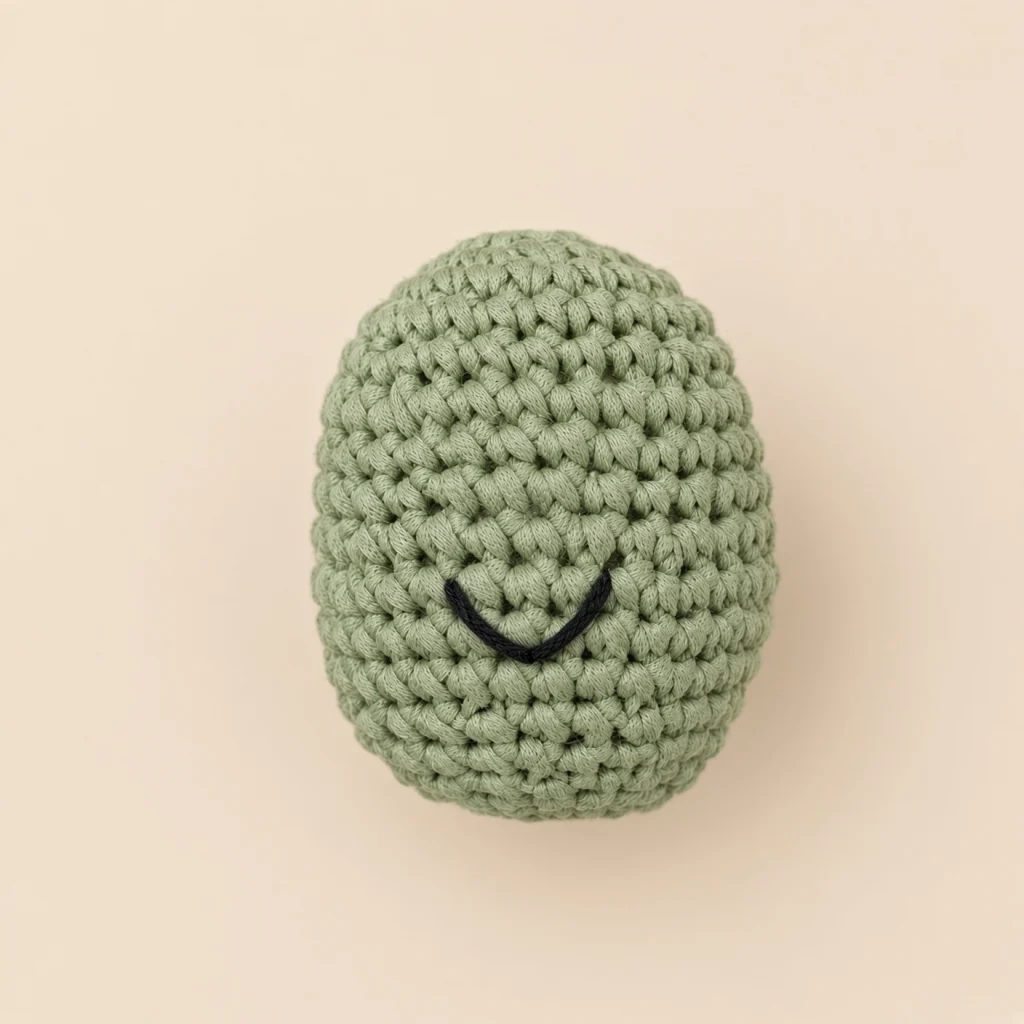 An embroidered smile curved by catching the middle of a long stitch