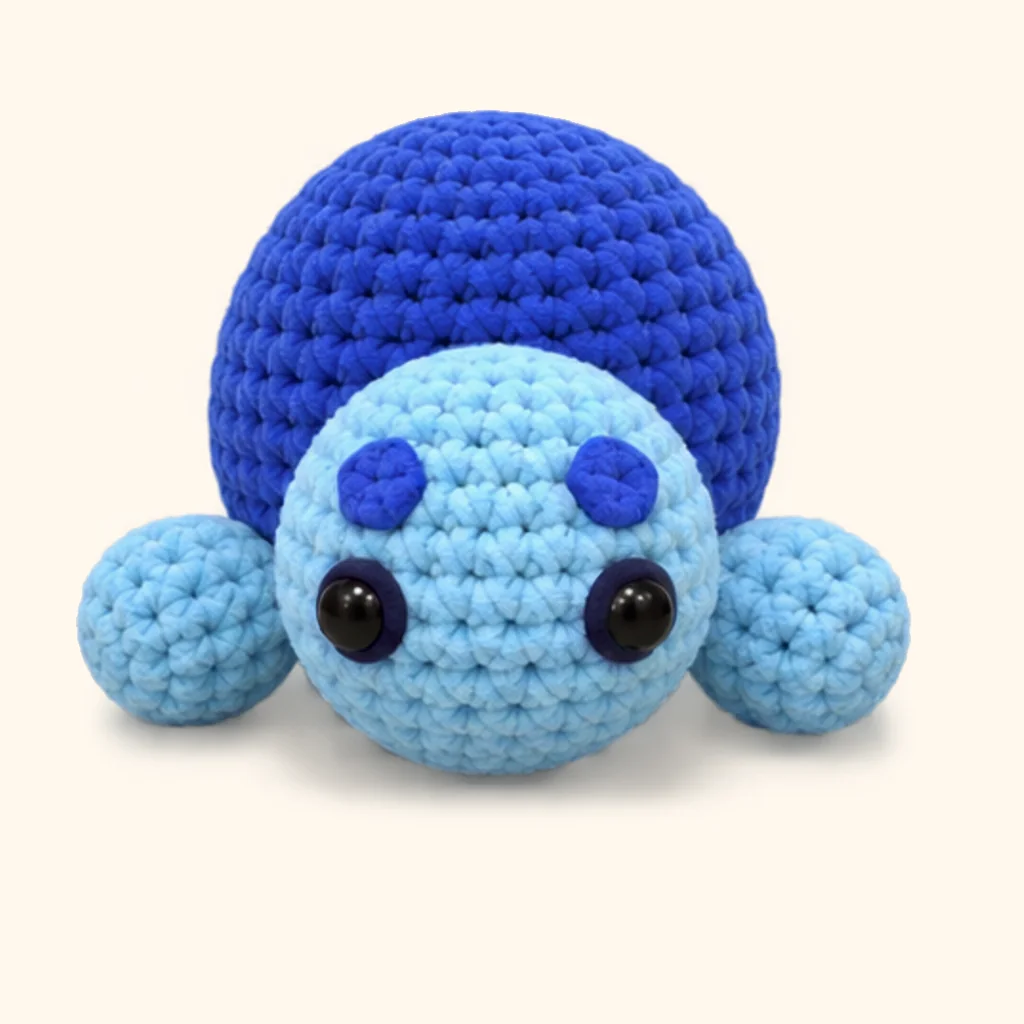 Blueberry turtle crochet assembly: attach the front flippers
