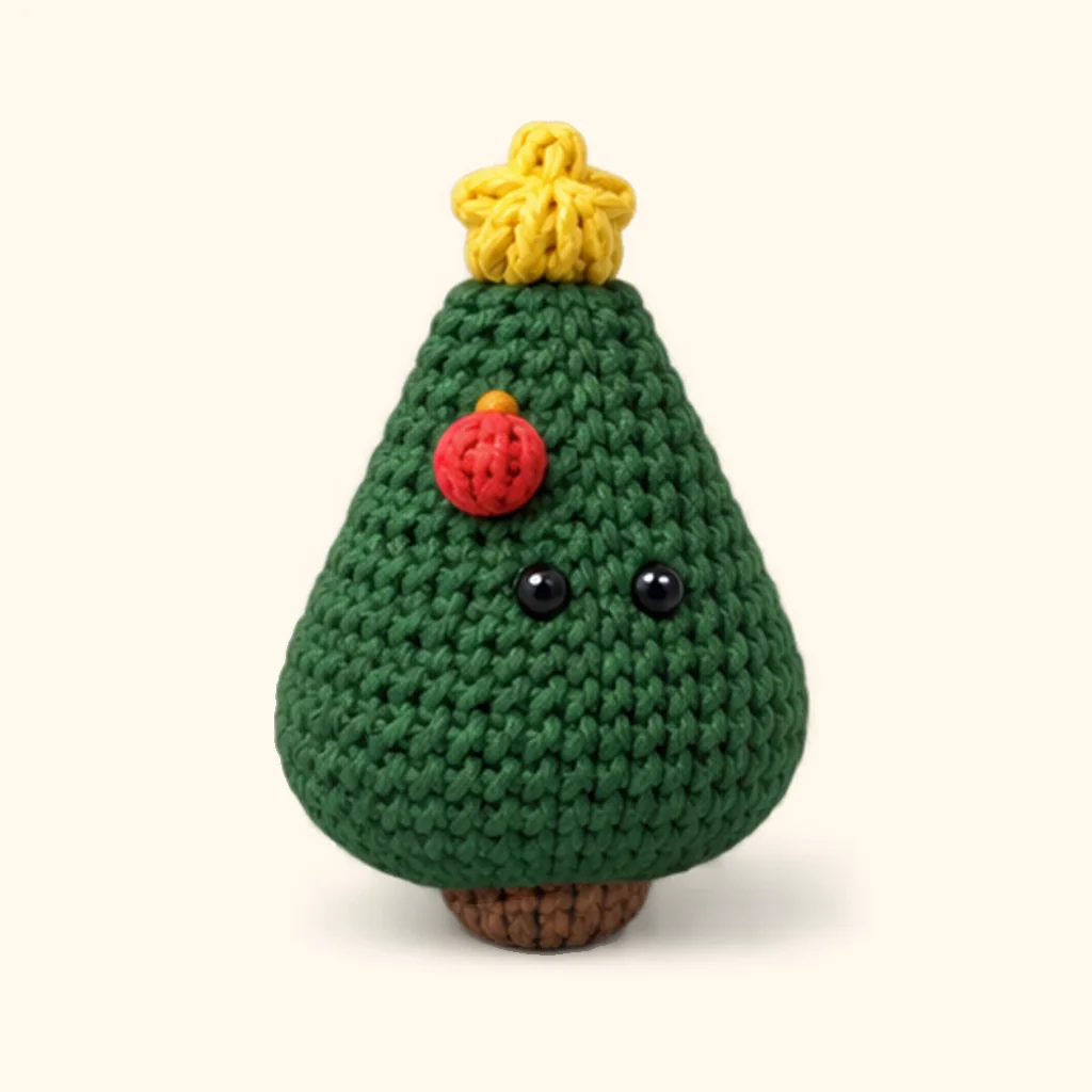 Christmas tree crochet assembly: attach the red bauble (upper)
