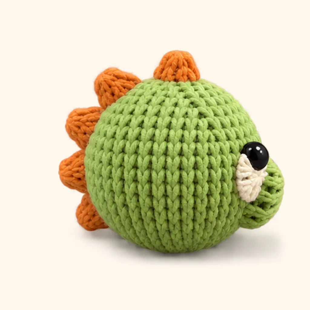 Dinosaur crochet assembly: attach the head spikes