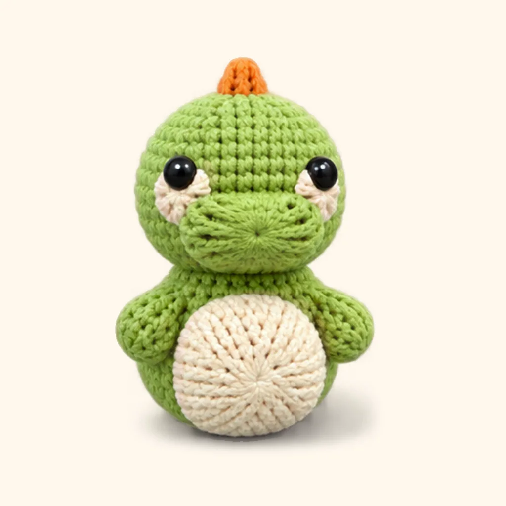 Dinosaur crochet assembly: attach the arms