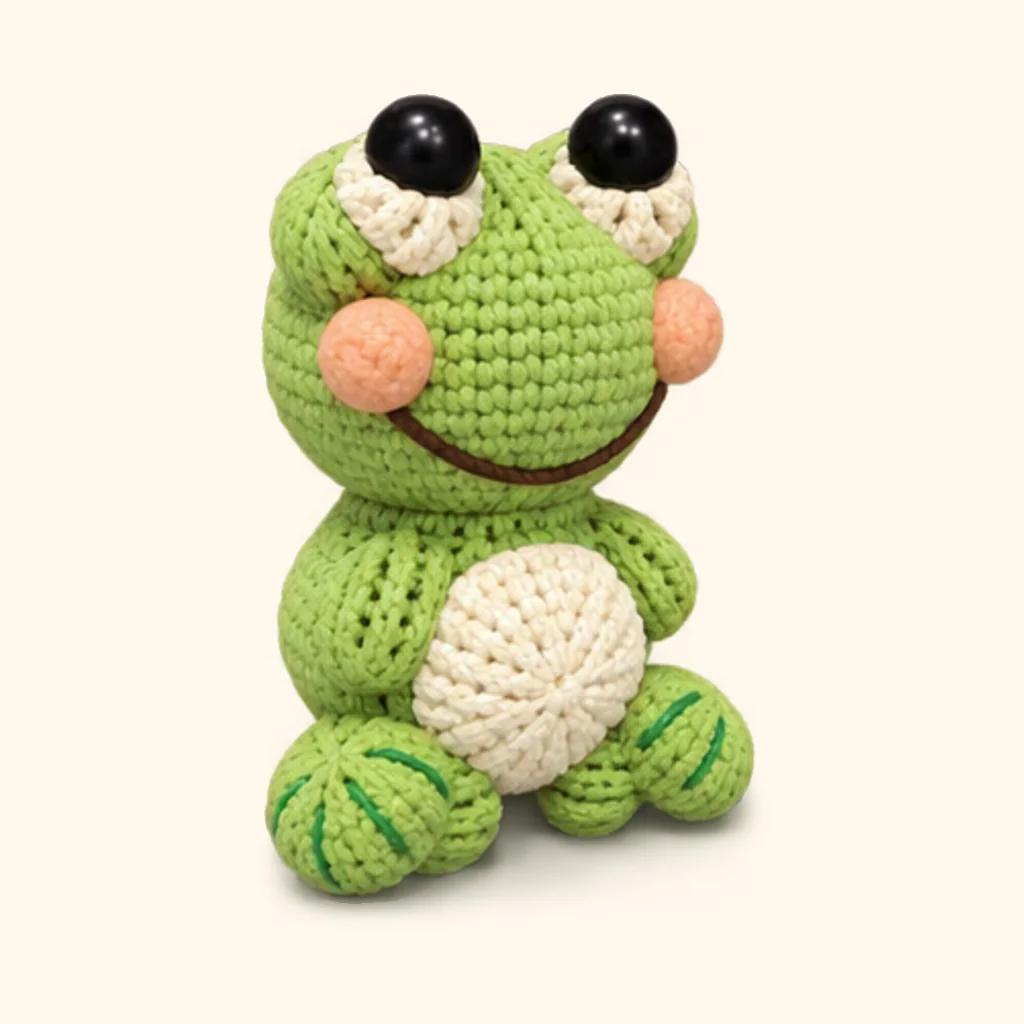 Frog crochet assembly: sew the cheeks
