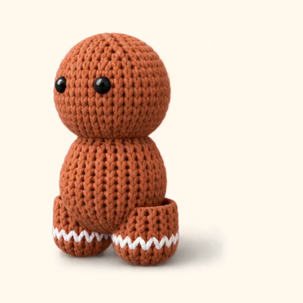 Gingerbread man crochet assembly: attach the legs