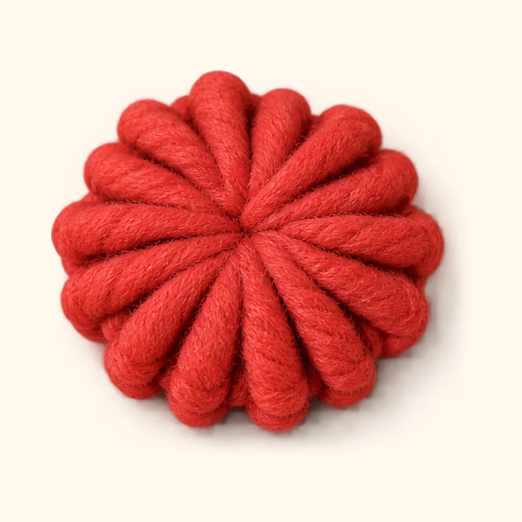 Gingerbread man amigurumi: the finished bottom button (red)