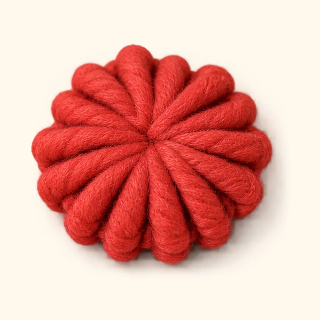 Gingerbread man amigurumi: the finished top button (red)
