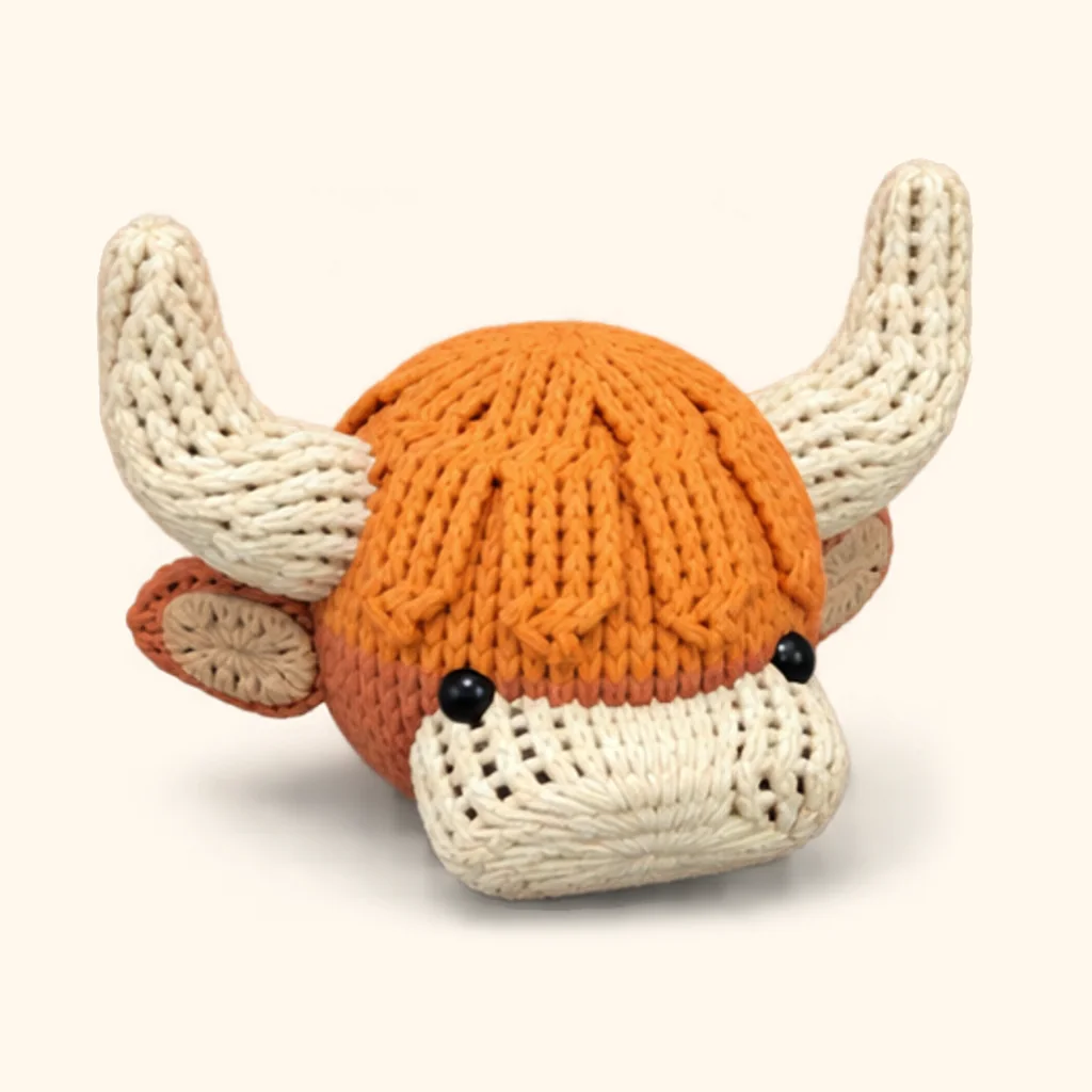 Highland cow crochet assembly: attach the fringe locks