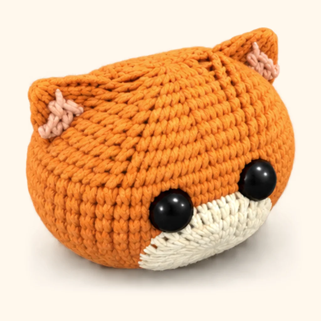 Orange tabby kitten crochet assembly: attach the ears