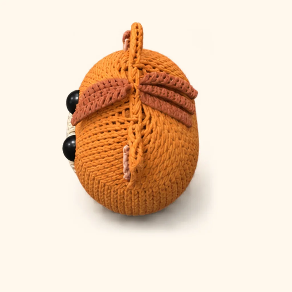 Orange tabby kitten crochet assembly: attach the back-of-head stripes