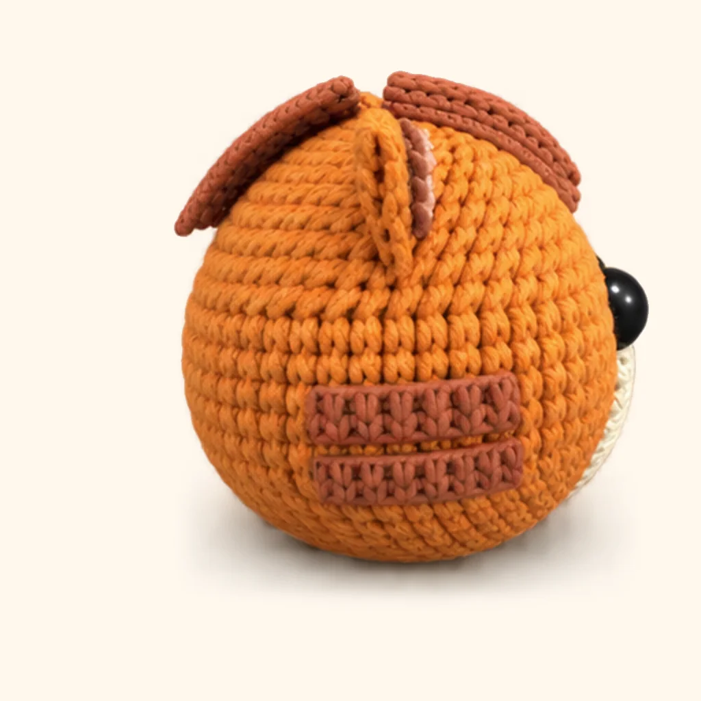 Orange tabby kitten crochet assembly: attach the lower cheek stripes