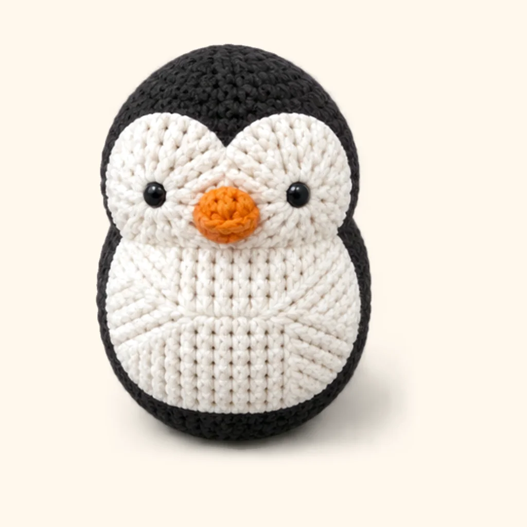 Penguin crochet assembly: attach the beak