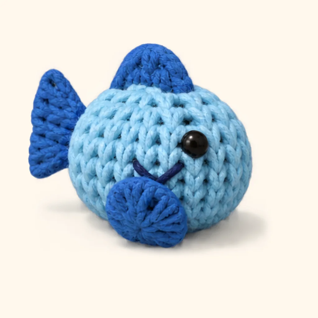 Penguin crochet assembly: sew the fish smile