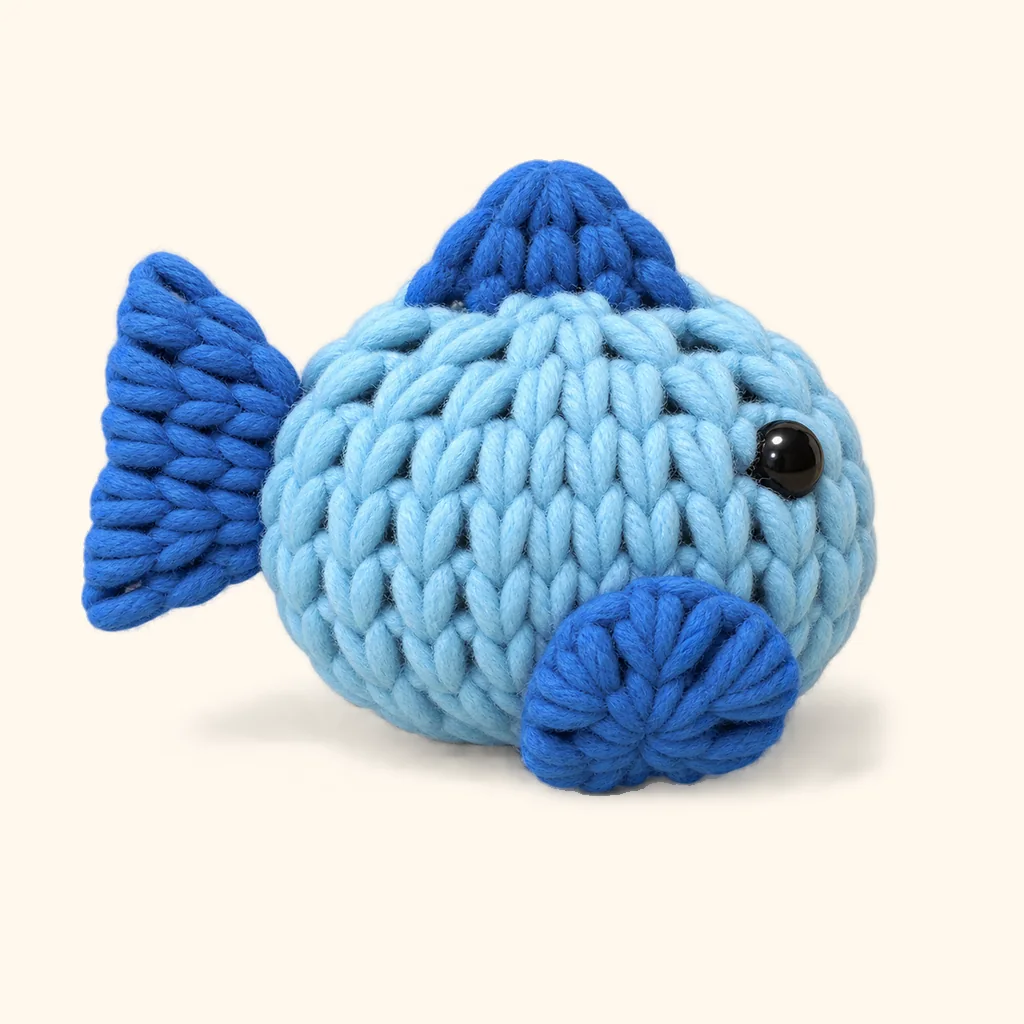 Penguin crochet assembly: attach the fish side fin