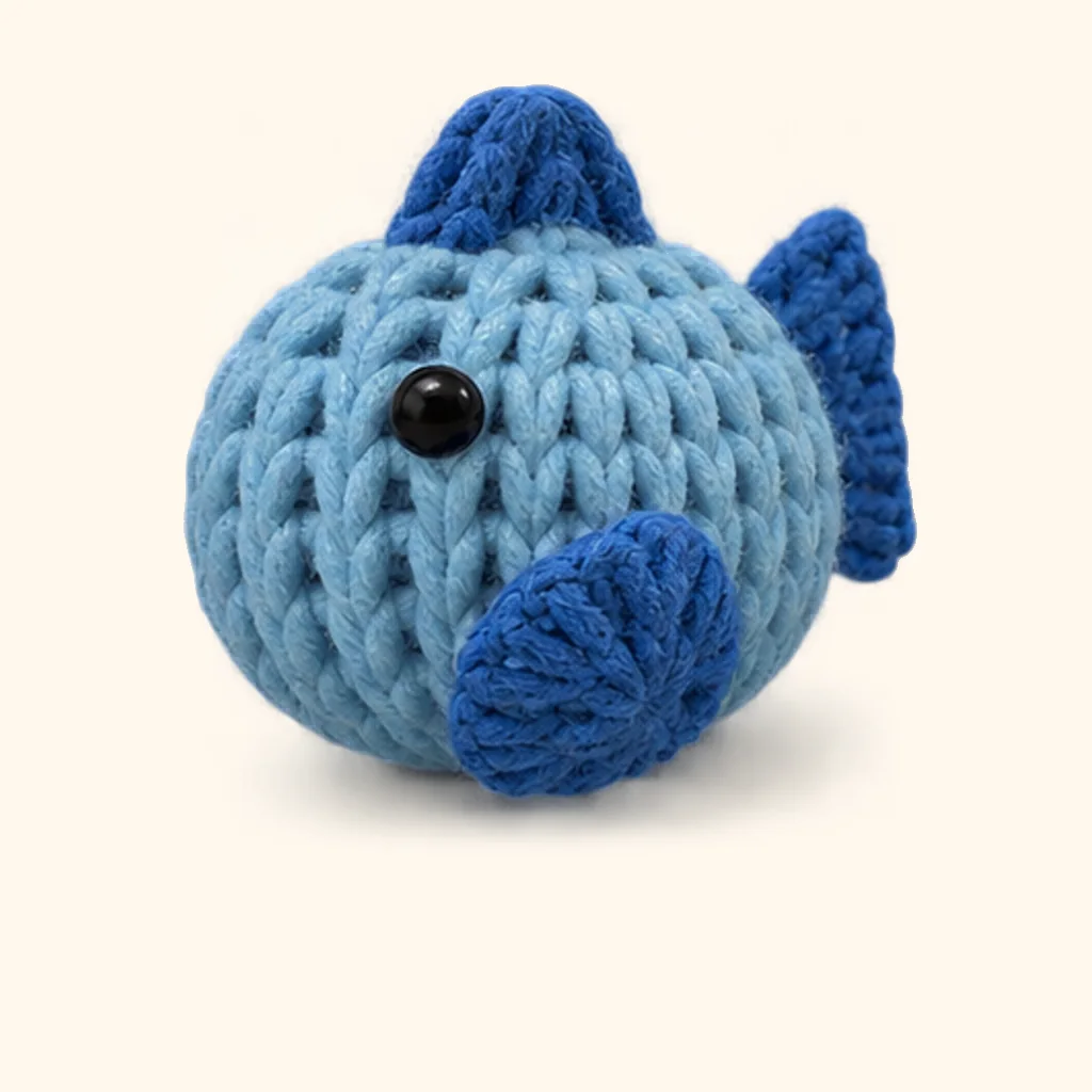 Penguin crochet assembly: attach the fish side fin (other side)