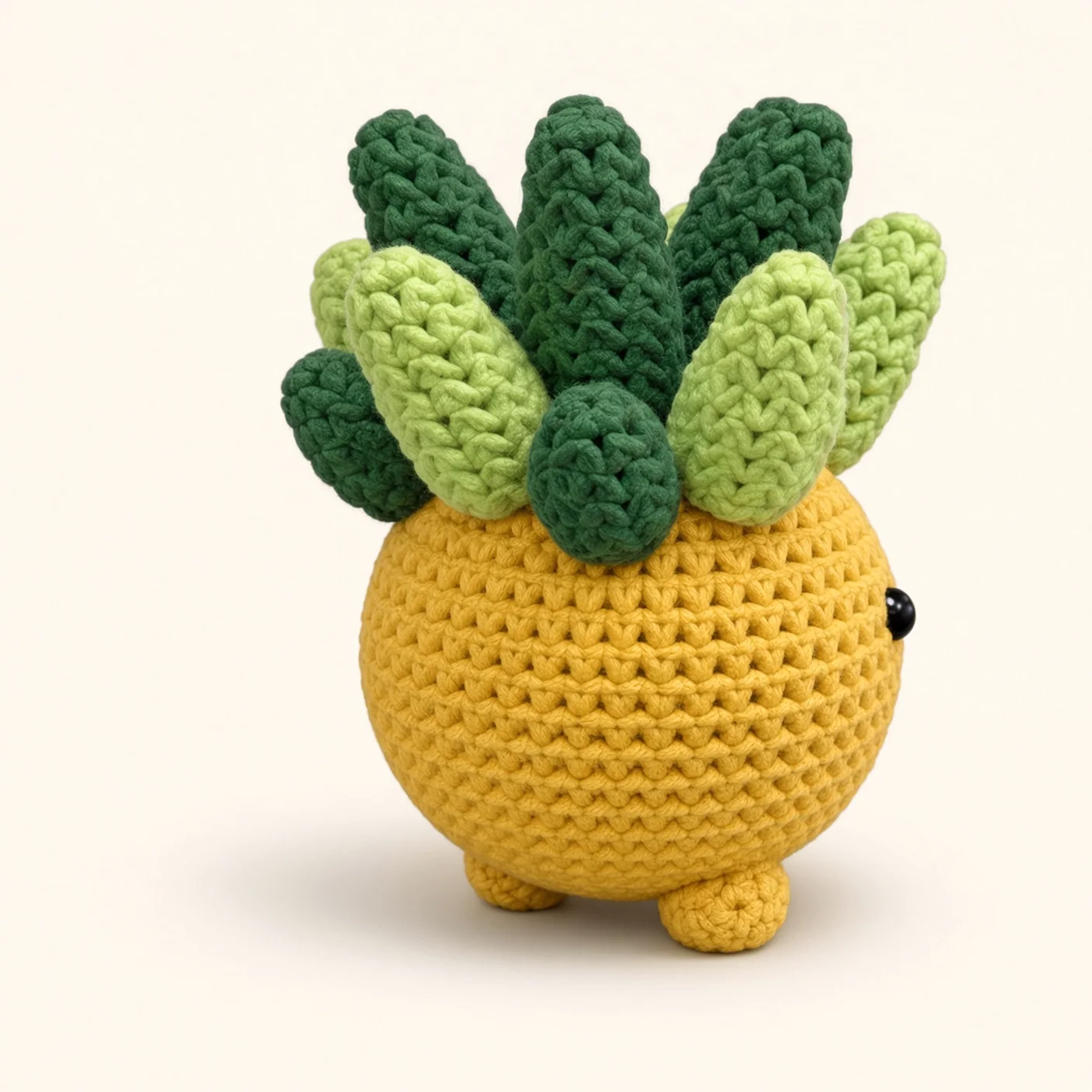 Pineapple crochet assembly: attach the low dark leaves