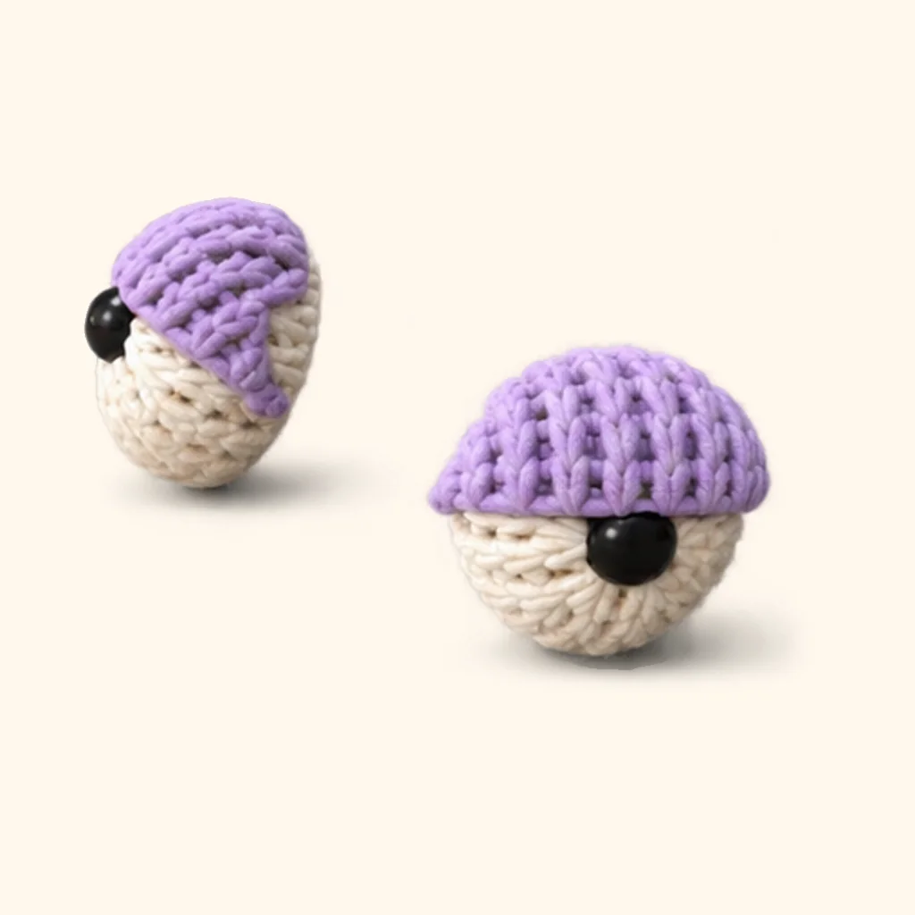 Rogue goat crochet assembly: attach the upper eyelids