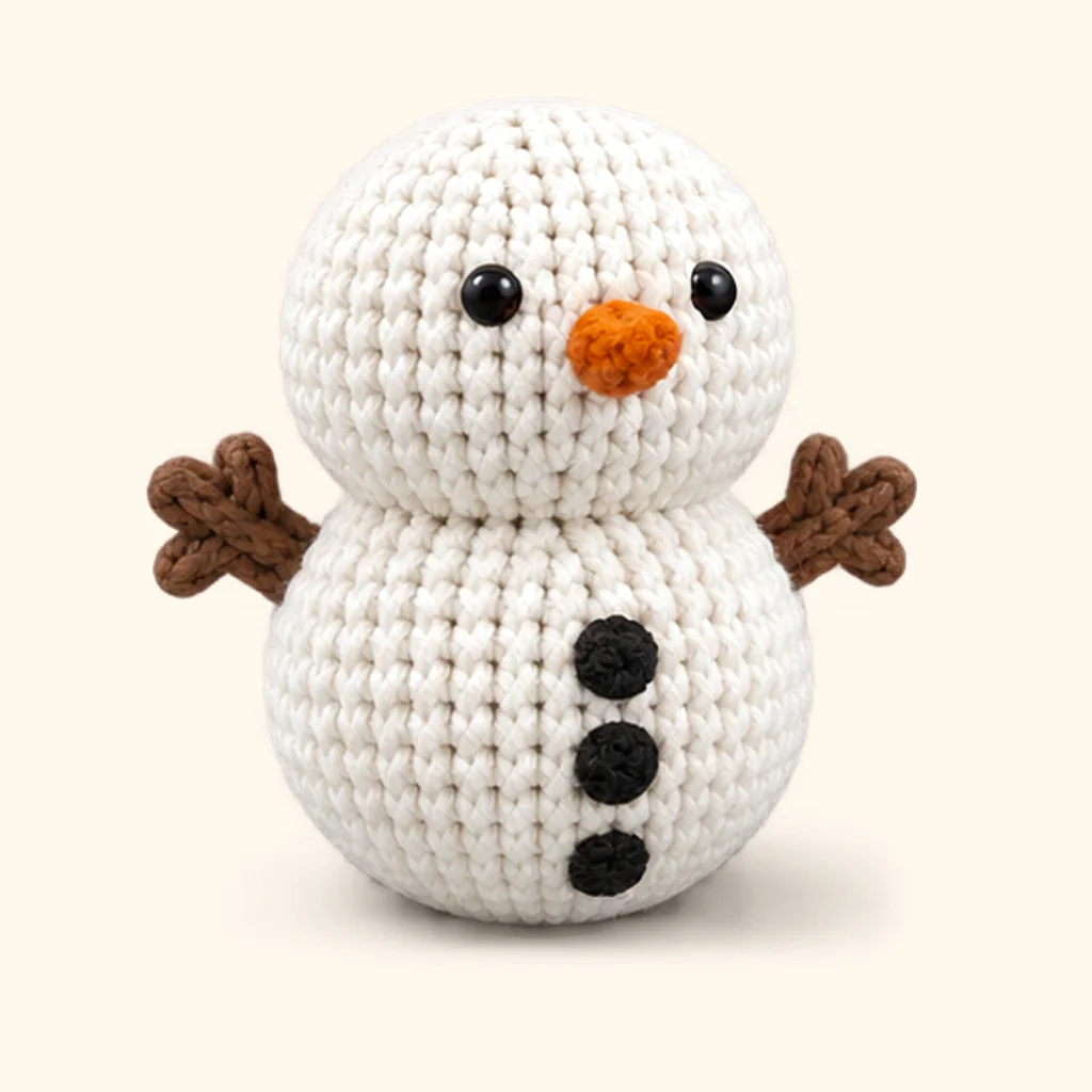 Snowman crochet assembly: attach the buttons
