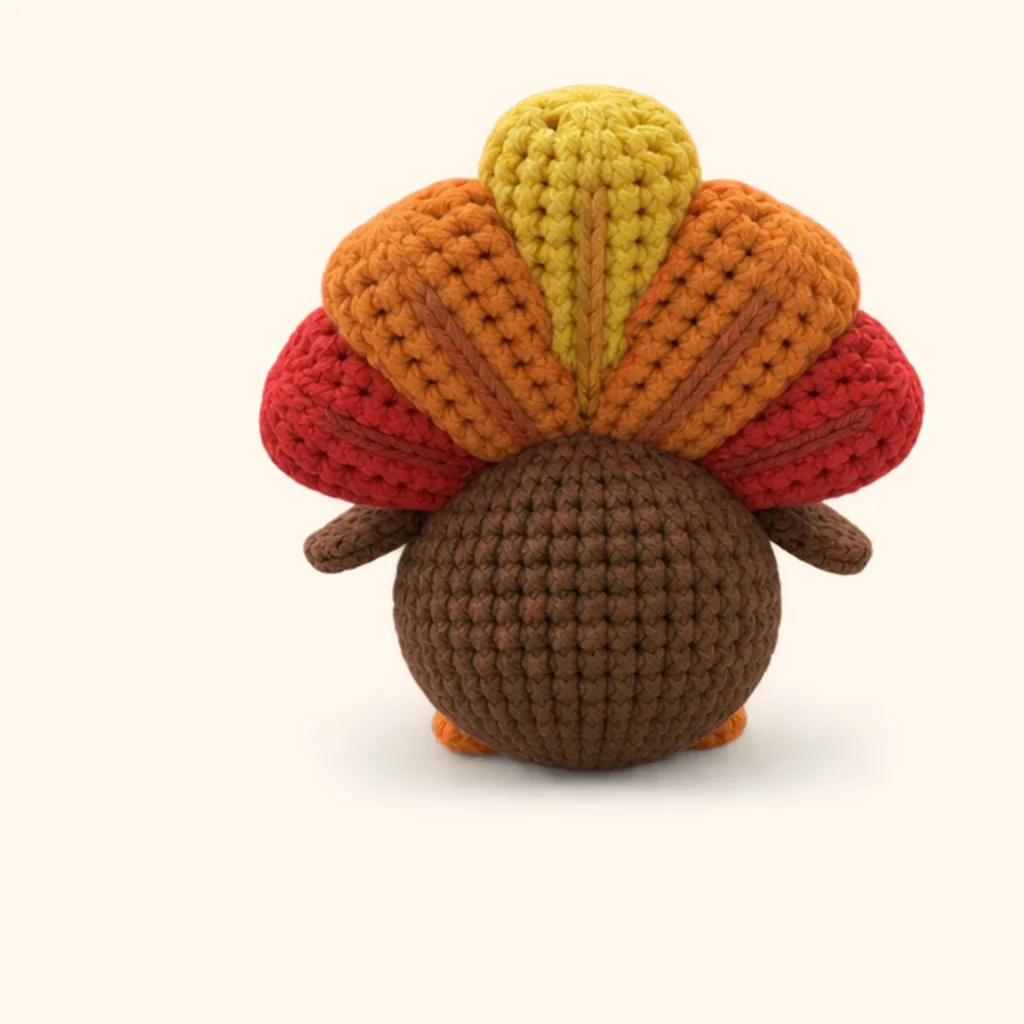 Turkey crochet assembly: sew the red feather crease, front